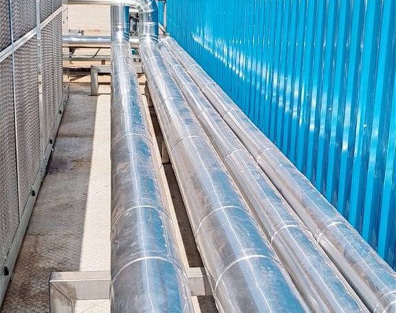 Installation and cladding of stainless steel piping for pre-formed plant.