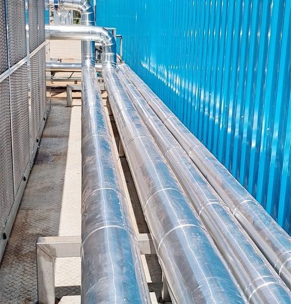 Installation and cladding of stainless steel piping for pre-formed plant.