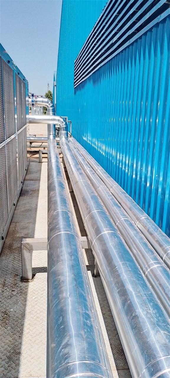Installation and cladding of stainless steel piping for pre-formed plant.