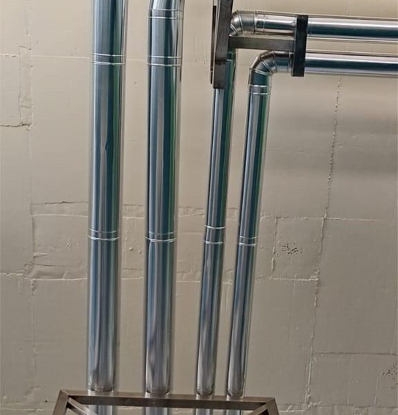 Installation and cladding of stainless steel piping for pre-formed plant.