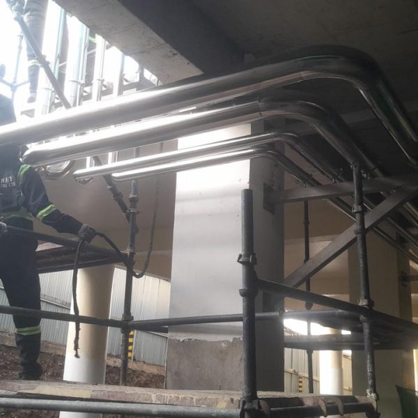 Installation and cladding of stainless steel piping for pre-formed plant.