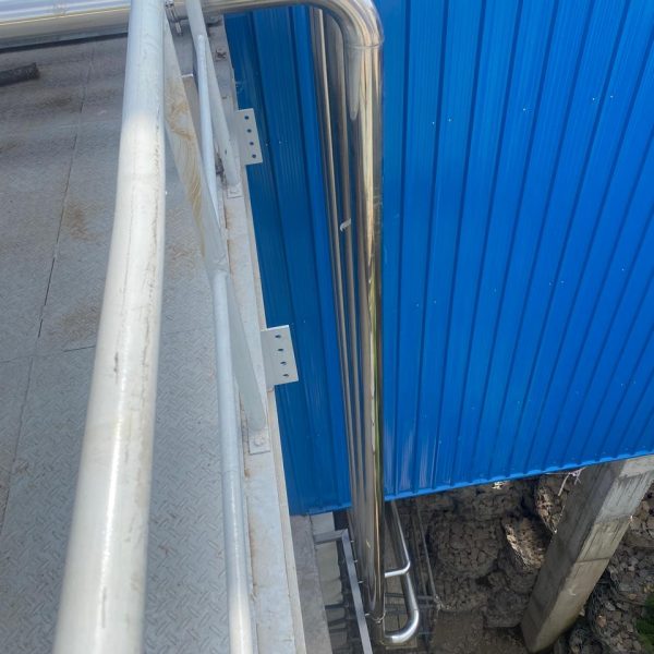 Installation and cladding of stainless steel piping for pre-formed plant.