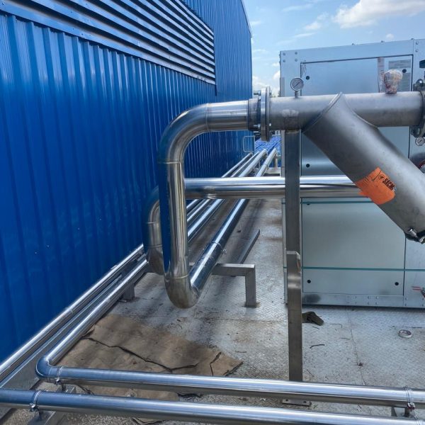 Installation and cladding of stainless steel piping for pre-formed plant.